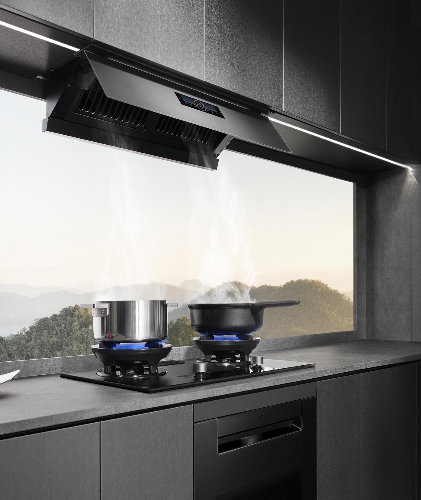 Modern kitchen with FOTILE range hood and cooktop overlooking a mountain view